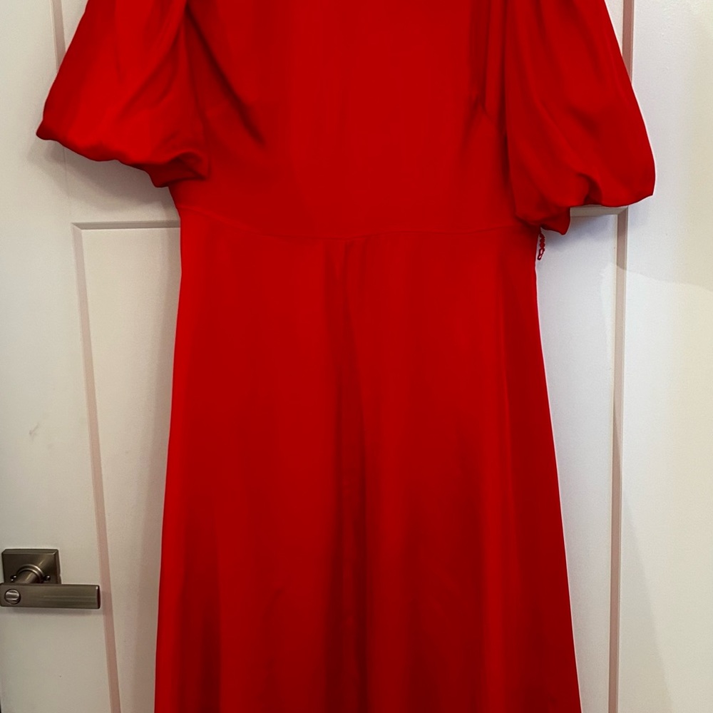 Red silk Kate Spade gown with puff sleeves.